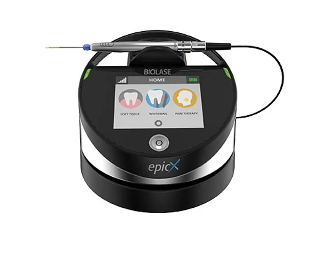 Manufacturer product image of the Biolase Epic X diode dental laser, with its handpiece resting on top and a touchscreen showing soft tissue, whitening and pain therapy modes